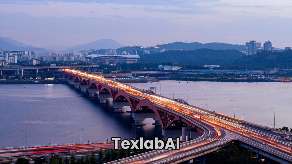 A long-exposure night view of Seongsan Bridge over Han River in Seoul representing South Korea's economic and technological miracle.